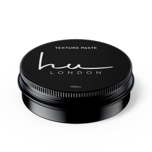 Black jar of texture paste with 'HU London' branding on a white background